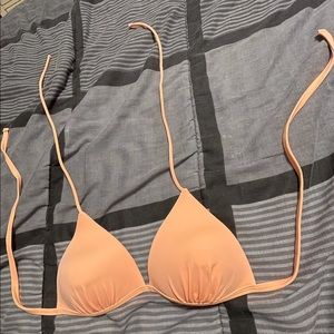 light orange bathing suit top. never worn. sz 7/9